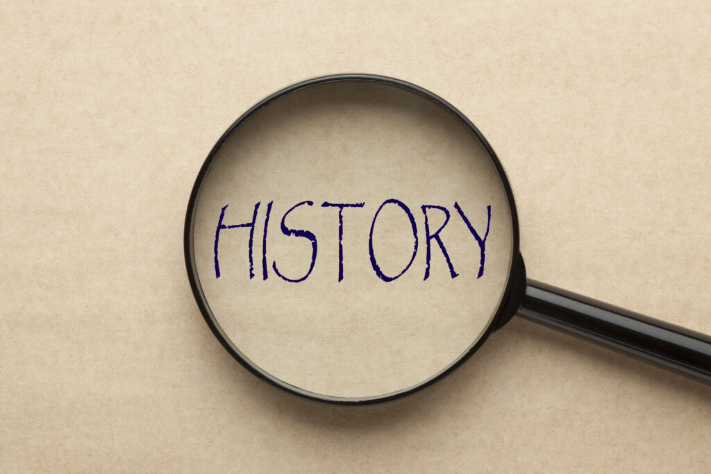 Magnifying glass focused on the word HISTORY